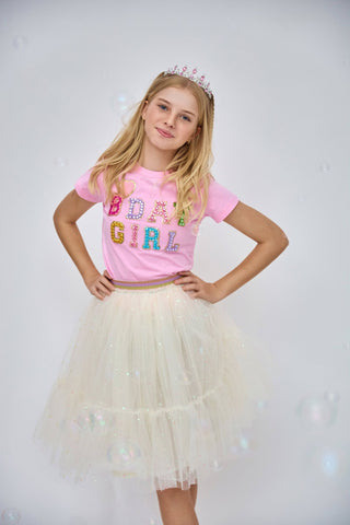 Lola and The Boys Birthday Girl Gem T-Shirt - Pink
Young girl wearing a pink 'Bday Girl' shirt and white tutu skirt with a tiara on a light gray background