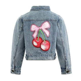 Lola and The Boys Crystal Cherry Bow Denim Jacket
A light blue denim jacket shown from the back, featuring a large decorative cherry and bow applique patch in pink, red, and green on the center back.
