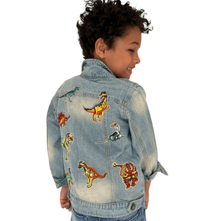 Lola and The Boys Dino Lovers Denim Jacket
Child wearing a denim jacket with dinosaur patches on a white background