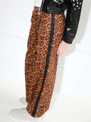 Lola and The Boys Leopard Print Sequin Trim Wide Leg Track Pants
Leopard print pants with black trim worn by a person on a white background