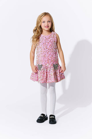 Lola and The Boys Rosie Bows Dress 
Young girl wearing a pink floral dress on a white background
