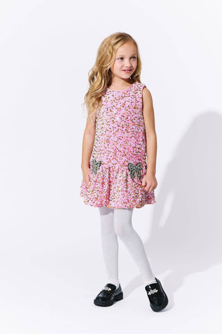 Lola and The Boys Rosie Bows Dress
Young girl wearing a pink floral dress with butterfly details on a white background
