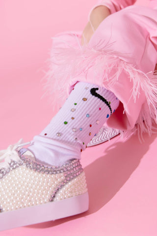 Lola and the Boys Gem Athletic Socks - White
White sneakers with pearl details and colorful polka dot socks on a pink background