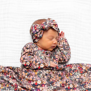 Lou Lou and Company Headband - Gracie
Newborn baby in a floral outfit and headband on a white background