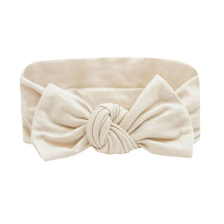 Lou Lou and Company Headband - Winnie
A cream-colored fabric headband with a large knotted bow in the center, shown against a plain white background.