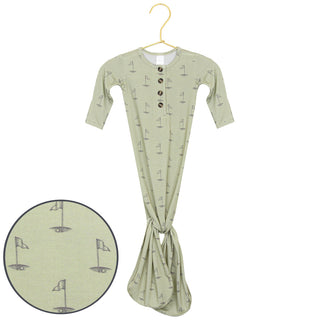 Lou Lou and Company Knotted Gown - Cal
Green baby wrap with sailboat pattern on a hanger against a white background