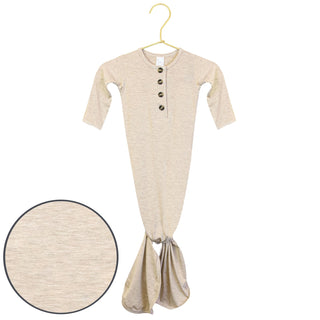Lou Lou and Company Knotted Gown - Ryan 
Beige baby onesie with buttons on a hanger against a white background