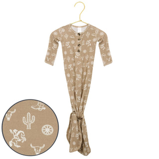 Lou Lou and Company Knotted Gown - Wyatt 
Baby onesie with cowboy pattern on a hanger, inset showing pattern details.