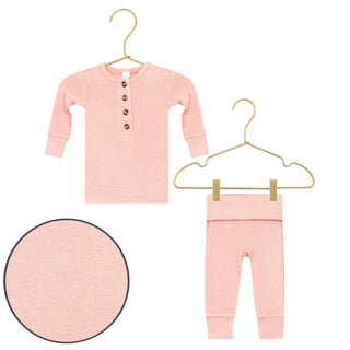Lou Lou and Company Plush Knit Top and Bottoms - Piper
Pink baby outfit with long-sleeve shirt and pants on hangers against a white background.