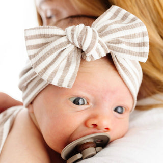 Lou Lou and Company Ribbed Headband - Indy
Baby with a large bow headband and pacifier