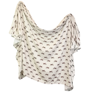 Lou Lou and Company Swaddle Blanket - Cruz
White scarf with black pattern on a white background