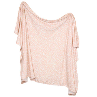 Lou Lou and Company Swaddle Blanket - Louise A light pink and white floral print draped poncho-style top with wide, flowing sleeves, shown against a plain white background.