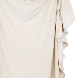 Lou Lou and Company Swaddle Blanket - Winnie
Close-up of a beige fabric with ruffled details on a white background