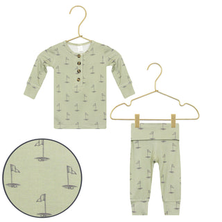 Lou Lou and Company Top and Bottoms - Cal
Children's green outfit with sailboat pattern on a white background