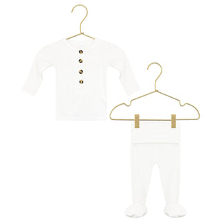 Lou Lou and Company Top and Bottoms - Finley
White baby outfit with buttons on a gold hanger against a white background