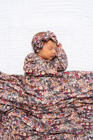 Lou Lou and Company Top and Bottoms - Gracie
Newborn baby wrapped in a floral blanket with a matching headband on a white background