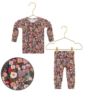 Lou Lou and Company Top and Bottoms - Gracie 
Floral patterned pajama set with top and pants on hangers against a white background.