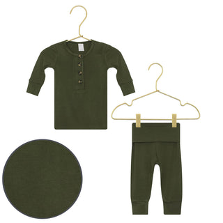 Lou Lou and Company Top and Bottoms - Riley
Green baby outfit with shirt, pants, and hat on hangers against a white background