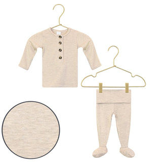 Lou Lou and Company Top and Bottoms - Ryan
Baby outfit with long-sleeve shirt and footed pants on hangers against a white background.