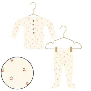 Lou Lou and Company Top and Bottoms - Sadie
Baby long-sleeve button-front top and footed pants set in cream, both printed with small red cherries with green stems. The top has three brown buttons.