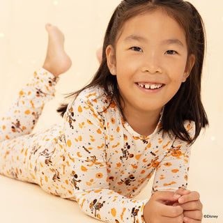 Magnetic Me Disney x Spooky Season Modal L/S Pajama Set
Child wearing a patterned outfit on a beige background