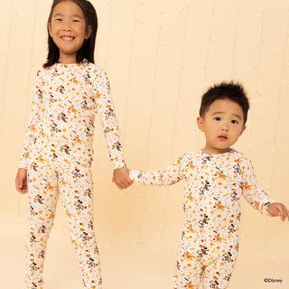 Magnetic Me Disney x Spooky Season Modal L/S Pajama Set
Two children wearing matching pajamas with a floral pattern on a beige background.