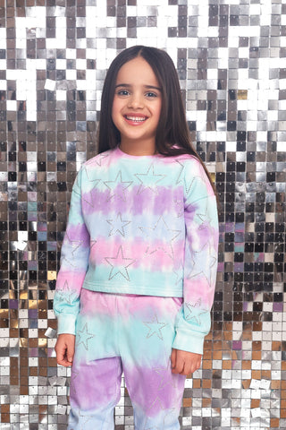 MIA New York Star Sweatshirt - Cotton Candy
MIA New York Star Sweatpant - Cotton Candy
A young girl smiling while wearing a pastel tie-dye long-sleeve sweatshirt and matching sweatpants with silver glittery star outlines, set against a silver mirror tile wall.