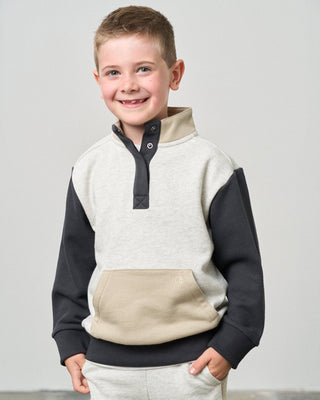 Little Bipsy Colorblock Mockneck Pullover - Stone Grey
Child wearing a two-tone sweater with a plain background