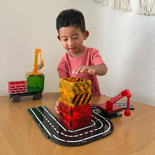 Magna-Tiles Builder 32-Piece Set featuring colorful plastic tiles for creative building and STEM play.