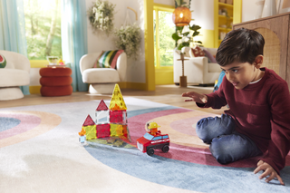 Colorful Magna-Tiles Fire Rescue 27-piece set toy with fire truck and rescue-themed building tiles for creative play.