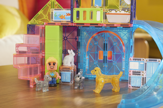 Magna-Tiles Pet Playhouse™ 50-Piece Set
Toy building set with transparent blocks and small figures on a wooden surface