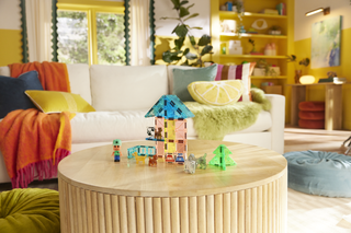 Magna-Tiles Puppy Park™ 27-Piece Set
Colorful living room with toys on a coffee table