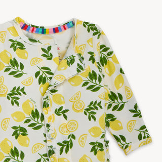 Magnetic Me Modal Footie with Ruffle - Simply the Zest
Baby onesie with lemon pattern on a white background