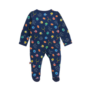 Magnetic Me Modal Magnetic Footie - First Down Fun
A baby footed one-piece sleeper in navy blue with a colorful sports-themed print of football helmets, footballs, hoops, and words like 'catch', 'run', and 'score', shown flat on a light gray background.