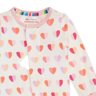 Magnetic Me Modal Magnetic Footie - Pink XOXO
Children's long-sleeve shirt with colorful heart pattern on a white background