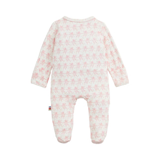 Magnetic Me Modal Magnetic Footie - Trunkettes PinkA baby footed one-piece sleeper in white with a repeating light pink teddy bear pattern, shown flat against a light off-white background.