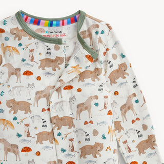 Magnetic Me Modal Magnetic Footie - Wonderful Wildlife
A close-up of a baby long-sleeve pajama top with an all-over woodland animal print. The pajamas feature a cream background with illustrations of bears, foxes, rabbits, squirrels, fish, mushrooms, and trees in earthy brown, orange, and teal colors.