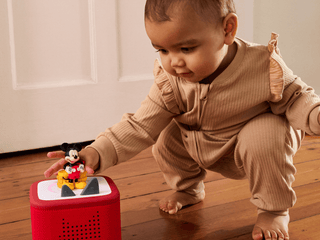 Tonies Character - Disney: Mickey Mouse Clubhouse
Child playing with a toy on a wooden floor