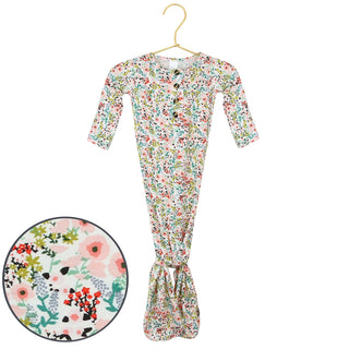 Lou Lou and Company Knotted Gown - Millie
Floral-patterned baby onesie on a hanger with a close-up inset of the pattern.