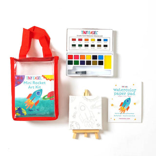 Tiny Easel Mini Art Kit - Rocket
Mini rocket art kit with watercolor paper pad, color chart, and red tote bag on a white background