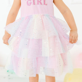 Model wearing a Sweet Wink Birthday Girl Fairy Dust short sleeve tutu dress, featuring a pink tutu and fairy-themed design.