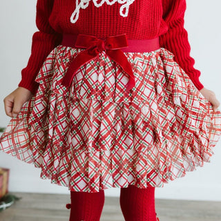 Sweet Wink Christmas Plaid Bow Tiered Tutu
Red sweater with plaid skirt and red bow on a neutral background