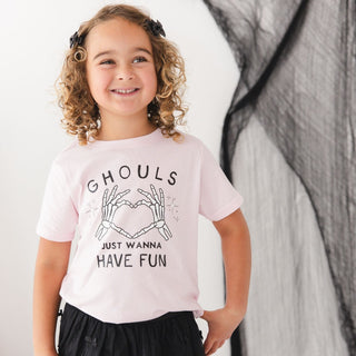 Sweet Wink Ghouls Just Wanna Have Fun Halloween Short Sleeve T-Shirt
A young girl with curly hair wearing a light pink graphic t-shirt that reads 'GHOULS JUST WANNA HAVE FUN' with skeleton hands forming a heart, posed against a white and black draped background.