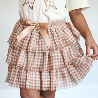 Sweet Wink Gingham Printed Tulle Tiered Tutu
Checkered skirt with a bow tie on a plain background