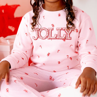 Sweet Wink Jolly Pearl Patch candy cane Christmas sweatshirt and flare leggings 2-piece holiday outfit on model