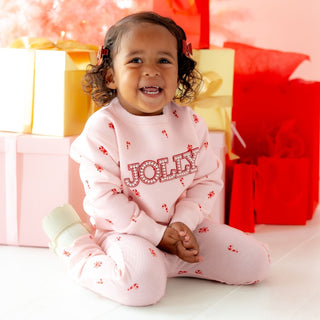 Sweet Wink 2-piece Christmas sweatshirt and flare leggings set featuring Jolly Pearl Patch and candy cane design on model.