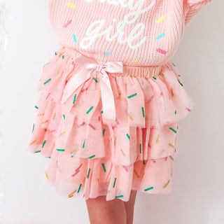 Sweet Wink Birthday Girl Sprinkle Tiered Tutu
Pink outfit with 'Pretty Girl' text and colorful sprinkles on a white background