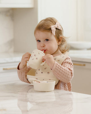 Mushie x Quincy Mae Heart Ditsy feeding set with a plate, bowl, cup, and utensils in soft pastel colors for babies and toddlers.