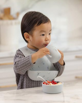 Mushie x Quincy Mae Space themed feeding set with plate, bowl, cup, and utensils for babies, featuring playful, space-inspired designs.