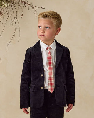 Noralee Sebastian Blazer - Black
Young boy wearing a black  blazer and plaid tie against a beige background